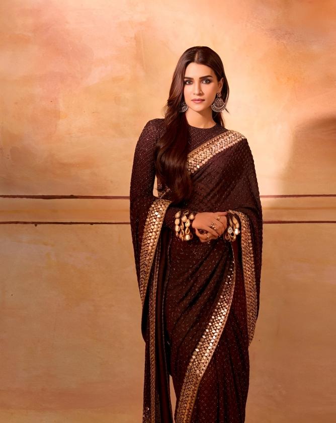 Kriti stuns in a mesmerizing brown saree customised by @arpitamehtaofficial. A beautiful piece of art! 